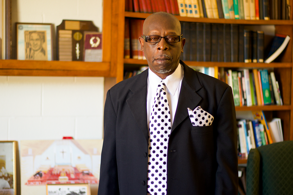 Library portrait with polka-dot tie